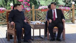 الرئيس الصيني شي جين بينغ وزعيم كوريا الشمالية كيم يونج أون - أرشيفية 