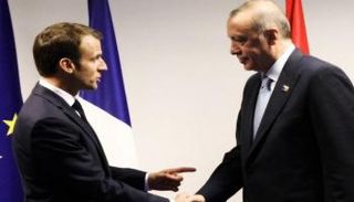 الرئيس الفرنسي ونظيره التركي خلال لقاء سابق 