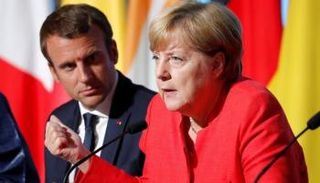 المستشارة الألمانية أنجيلا ميركل والرئيس الفرنسي إيمانويل ماكرون 