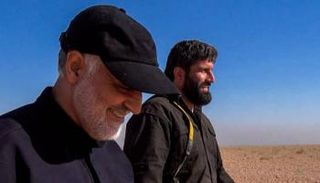 باشبور إلى جوار قاسم سليماني - أرشيفية