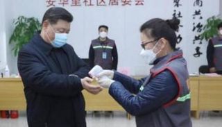 الرئيس الصيني يظهر بالكمامة