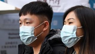 فيروس كورونا يدفع الموظفين في آسيا للعمل من المنزل - أرشيفية