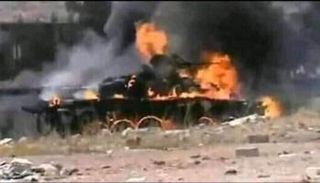 آلية عسكرية تابعة للمليشيات بعد تدميرها -أرشيفية