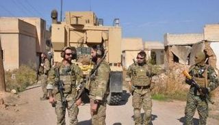 عناصر من قوات قسد والتحالف في عملية سابقة