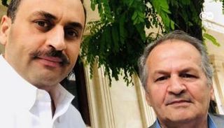 الأكاديمي الأفغاني نجيب مايل ونجله - أرشيفية