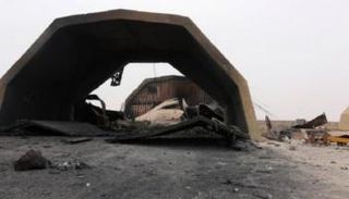 صورة متداولة لآثار القصف على قاعدة الوطية الجوية