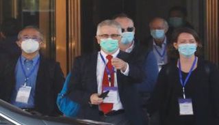 أعضاء فريق منظمة الصحة العالمية في ووهان