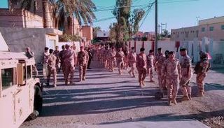 أمنيون عراقيون يستعدون للإداء بأصواتهم بـ