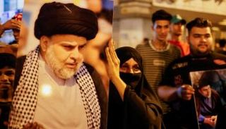 عراقيون يرفعون صورة زعيم التيار الصدري العراقي مقتدى الصدر