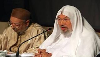 يوسف القرضاوي وراشد الغنوشي في لقاء سابق- أرشيفية