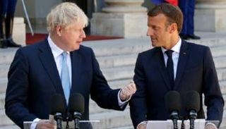 إيمانويل ماكرون وبوريس جونسون خلال لقاء سابق