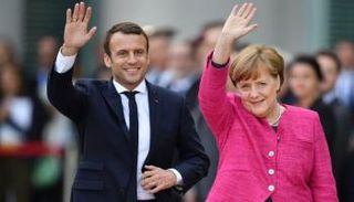 ميركل وماكرون في لقاء سابق