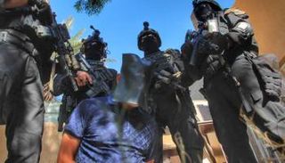 قوة عراقية أمنية تعتقل أحد قيادات داعش - أرشيفية