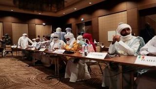 أطراف من الحكومة المالية في مؤتمر دولي سابق