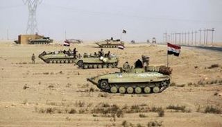 قوة من الجيش العراقي قرب الحدود السورية 