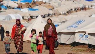 لاجئون سوريون بمخيمات النزوح شمالي العراق