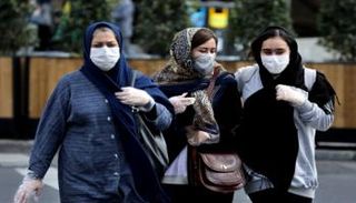 سيدات يرتدين كمامات للوقاية من كورونا بإيران- أرشيفية