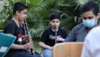 صور.. أطفال العراق يتعلمون موسيقى باخ وبيتهوفن