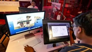 مصممون يعملون في مقر شركة لمسابقات الألعاب الإلكترونية في دبي - أ ف ب