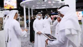 الدكتور أحمد بن عبد الله حميد بالهول الفلاسي في معرض سوق السفر العربي