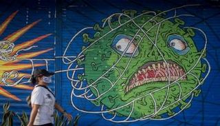 لوحة جدارية عن فيروس كورونا