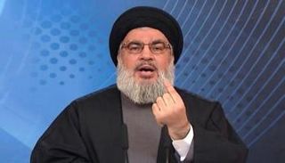 حسن نصر الله زعيم مليشيا 