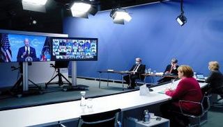 لقاء سابق غير مباشر بين بايدن وميركل