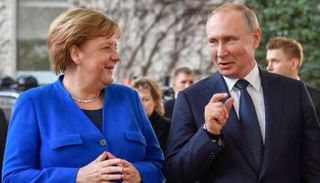 بوتين وميركل 