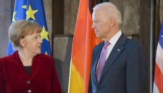 بايدن وميركل خلال لقاء سابق - أرشيفية