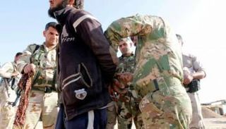 عنصر من داعش في قبضة القوات الأمنية العراقية- أرشيفية