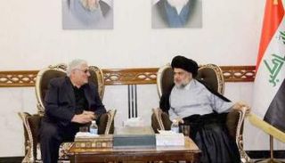 الصدر وسكرتير الحزب الشيوعي  رائد فهمي في لقاء سابق 