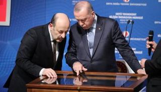 أردوغان ورئيس مجلس التعليم العالي المقال