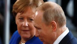 الرئيس الروسي والمستشارة الألمانية - أرشيفية