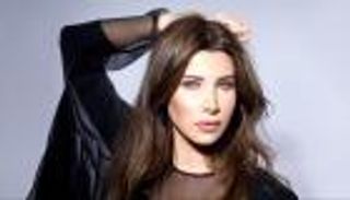 صور.. نانسي عجرم تتألق بإطلالة هادئة في حفل زفاف شقيقها