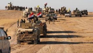 قوة أمنية خلال عملية عسكرية في كركوك