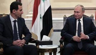 لقاء سابق بين الرئيس الروسي فلاديمير بوتين ونظيره بشار الأسد - أ.ف.ب