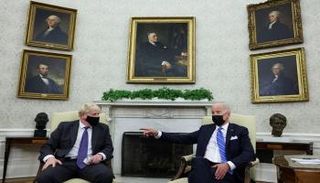 الرئيس الأمريكي خلال لقاء رئيس الوزراء البريطاني بالبيت الأبيض- رويترز