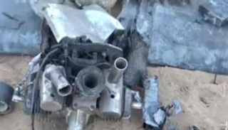 حطام محرك الطائرة بعد إسقاطها في حريب