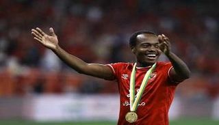 بيرسي تاو لاعب الأهلي المصري