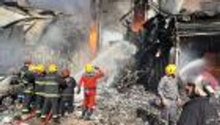 حريق في بناية تجارية ببغداد.. و40 فرقة تسيطر على ألسنة اللهب (صور)