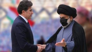 الصدر ورئيس إقليم كردستان نيجرفان بارزاني في لقاء سابق