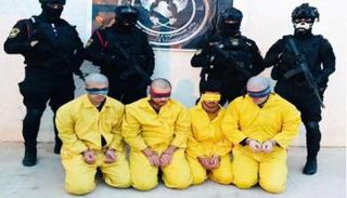 عناصر من تنظيم داعش تحت قبضة الأمن العراقي