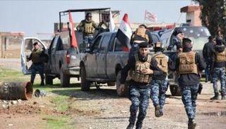 قوة أمنية خلال عمليات ملاحقة لعناصر داعش - أرشيفية