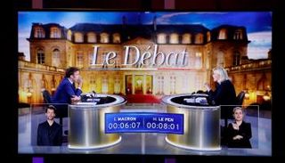 جانب من المناظرة بين ماكرون ولوبان