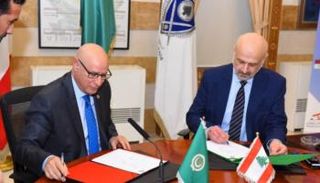 بسام مولوي وأحمد رشيد الخطابي خلال توقيع مذكرة التفاهم