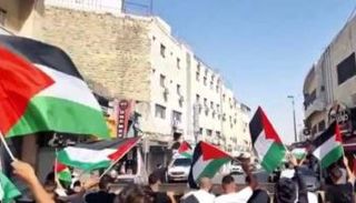 مظاهرة بالأعلام الفلسطينية في مدينة القدس