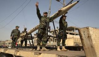 مليشيا مسلحة تستعرض في بغداد (أرشيفية)