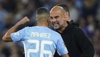 رياض محرز وبيب جوارديولا في مانشستر سيتي