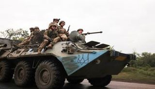 جنود أوكرانيون بعد معارك في محيط كييف- رويترز