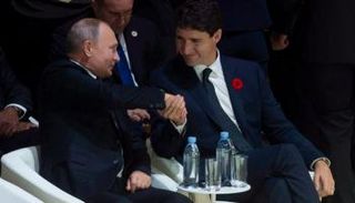 لقاء قديم يجمع الرئيس الروسي فلاديمير بوتين ورئيس وزراء كندا جاستن ترودو 